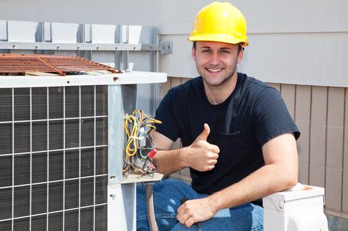 Man Giving Thumbs Up While Performing Air Conditioning Repair in Lake Mary, Sanford, Orange City, Deland, Debary, Lake Helen, and Nearby Cities